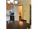 Open-concept laundry room featuring modern appliances and access to the dining area at 2285 S Jasper Way # A, Aurora, CO 80013