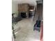 Inviting living space with stone fireplace, comfortable seating, and an open view to the kitchen and staircase at 2285 S Jasper Way # A, Aurora, CO 80013