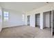 Spacious main bedroom with carpet flooring and walk-in closet at 1940 S Haleyville Way, Aurora, CO 80018