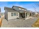 Backyard featuring a covered patio, gravel landscaping, and privacy fencing at 5411 Edenborn Way, Castle Rock, CO 80104