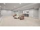 Bright and open basement area featuring cozy seating, open layout, and recessed lighting at 5411 Edenborn Way, Castle Rock, CO 80104