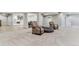 Open basement with entertainment center, bar, and plush seating at 5411 Edenborn Way, Castle Rock, CO 80104