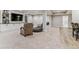 Finished basement with built-in entertainment center, neutral carpet, and plenty of seating at 5411 Edenborn Way, Castle Rock, CO 80104