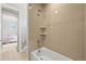 Modern tiled bathroom with large tub and shower, along with a toilet and tiled floors at 5411 Edenborn Way, Castle Rock, CO 80104