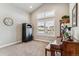 Bedroom with vaulted ceiling, neutral carpet, shutters and piano at 5411 Edenborn Way, Castle Rock, CO 80104