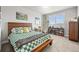 Cozy bedroom featuring a large window, desk, and modern furnishings at 5411 Edenborn Way, Castle Rock, CO 80104
