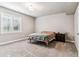 Neutral bedroom showcasing large window, neutral walls, carpet, and contemporary furnishings at 5411 Edenborn Way, Castle Rock, CO 80104