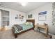Cozy room with wooden bed frame and desk; natural light from the window at 5411 Edenborn Way, Castle Rock, CO 80104