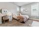 Bright bedroom with a full bed, desk, and chair at 5411 Edenborn Way, Castle Rock, CO 80104