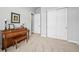 Bonus room featuring neutral walls and carpet, a piano with bench, and closet for easy storage at 5411 Edenborn Way, Castle Rock, CO 80104