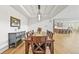 Formal dining room with wood table, chandelier, and open kitchen view at 5411 Edenborn Way, Castle Rock, CO 80104