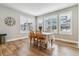 Bright dining room with wood floors, large windows with shutter blinds and views of the neighborhood at 5411 Edenborn Way, Castle Rock, CO 80104