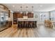 Modern kitchen boasts a large island, stainless steel appliances, and custom cabinets at 5411 Edenborn Way, Castle Rock, CO 80104