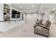 Spacious living room with built-in cabinets, shelving, and plush seating for entertainment at 5411 Edenborn Way, Castle Rock, CO 80104
