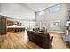 Spacious living room featuring hardwood floors, fireplace, and an open floor plan to the gourmet kitchen at 5411 Edenborn Way, Castle Rock, CO 80104