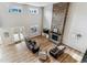Bright living room features soaring ceilings, wood floors, stone fireplace and updated furniture at 5411 Edenborn Way, Castle Rock, CO 80104