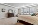 Large main bedroom with neutral carpet and large windows with shutter blinds at 5411 Edenborn Way, Castle Rock, CO 80104