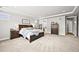 Main bedroom features neutral decor, a walk-in closet, and an en-suite bathroom at 5411 Edenborn Way, Castle Rock, CO 80104