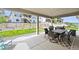 Covered patio with a dining table set, chairs and a grill, looking out at the yard and the views at 5411 Edenborn Way, Castle Rock, CO 80104