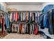 Spacious walk-in closet with shelving and racks for hanging clothing and storing shoes and accessories at 5411 Edenborn Way, Castle Rock, CO 80104