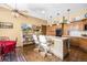 Spacious kitchen boasts a center island with seating, custom cabinets, and stylish pendant lighting at 9873 Greensview Cir, Lone Tree, CO 80124