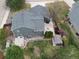 Aerial view of a charming backyard with mature trees, shed, patio, and a well-maintained lawn at 1521 Redtail Ct, Longmont, CO 80504