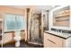 Modern bathroom featuring corner shower with decorative tile and white vanity at 1521 Redtail Ct, Longmont, CO 80504
