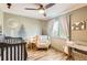 Charming Bedroom with themed wallpaper, cozy chair, and wood-look floors at 1521 Redtail Ct, Longmont, CO 80504