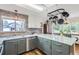 Well-appointed kitchen with a granite countertop, modern appliances, lots of light, and hardwood floors at 1521 Redtail Ct, Longmont, CO 80504