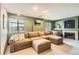 Inviting living room featuring a fireplace, plush sofa, and cozy decor at 1521 Redtail Ct, Longmont, CO 80504