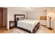 Comfortable main bedroom with soft lighting, neutral colors, and a decorative rug at 1521 Redtail Ct, Longmont, CO 80504