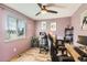 Spacious home office with natural light, modern furnishings, and wood-look floors at 1521 Redtail Ct, Longmont, CO 80504