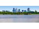 Downtown Denver skyline view across the water from a lush, green park at 6000 W 29Th Ave, Denver, CO 80214