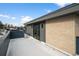 Rooftop deck with brick wall and sliding glass door access at 535 Josephine St, Denver, CO 80206