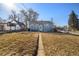 Spacious backyard featuring a well-maintained lawn, perfect for outdoor activities and relaxation at 4196 Chase St, Denver, CO 80212