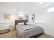 This basement bedroom features new carpet, shelving, neutral colors and ample lighting, creating a peaceful retreat at 4196 Chase St, Denver, CO 80212