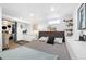Basement bedroom offering a cozy carpeted space, ample lighting, and built-in shelves, creating a comfortable retreat at 4196 Chase St, Denver, CO 80212
