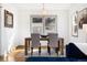 Dining room features a modern table with seating for four under a stylish chandelier at 4196 Chase St, Denver, CO 80212