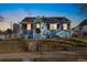 Charming blue home with a cozy front porch and well-maintained landscaping at 4196 Chase St, Denver, CO 80212