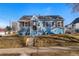 Charming home featuring a cozy porch, updated shutters, and a well-maintained front yard at 4196 Chase St, Denver, CO 80212