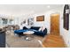 Open-concept living room flows into a dining area, showcasing hardwood floors and natural light at 4196 Chase St, Denver, CO 80212