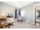 Bright home office featuring hardwood floors, neutral walls, and a comfortable chair, providing a tranquil workspace at 4196 Chase St, Denver, CO 80212