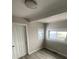 This bedroom features a window for natural light and plank flooring throughout at 521 10Th St, Fort Lupton, CO 80621