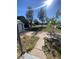 View of the front yard of a home with a driveway and shade trees at 521 10Th St, Fort Lupton, CO 80621