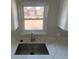 Kitchen with undermount sink and faucet under the window at 521 10Th St, Fort Lupton, CO 80621