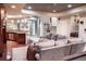 Finished basement recreation room with wet bar, pool table, and comfortable seating at 6588 S Sheridan Loop, Littleton, CO 80123