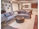Finished basement with sectional sofa and ottoman, perfect for relaxing and entertaining at 6588 S Sheridan Loop, Littleton, CO 80123