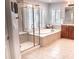 Bathroom boasts a large soaking tub and walk-in shower at 6588 S Sheridan Loop, Littleton, CO 80123