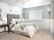 Bedroom with a queen-size bed and window seating at 6588 S Sheridan Loop, Littleton, CO 80123