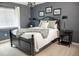 Bedroom with dark wood bed frame and gray walls at 6588 S Sheridan Loop, Littleton, CO 80123